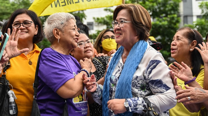 Former senator and human rights lawyer Leila de Lima (center right) acknowledges supporters after a court acquitted her of the last criminal charges against her, outside the court in Muntinlupa, Manila, Philippines, June 24, 2024. 